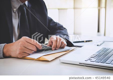Money in human hands form of dollar bills, Businessman is counti 45149540