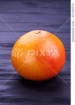 Fresh whole grapefruit on dark background. Fresh whole grapefruit on dark background. 45149574