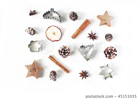 Christmas festive styled food composition, pattern. Pine cones, dried apple fruit, cinnamon, vintage 45151035