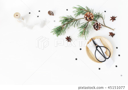 Christmas craft composition. Decorative corner made. Pine branch with cones, silk ribbons, vintage 45151077