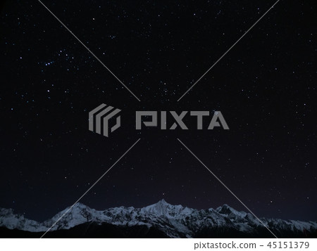 Meinan Snow Mountain and the Starry Sky at night, Yunnan, China / night sky over Mt. Meili Meinan Snow Mountain and the Starry Sky at night, Yunnan, China / night sky over Mt. Meili 45151379