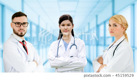 Doctor working in hospital with other doctors. 45159529