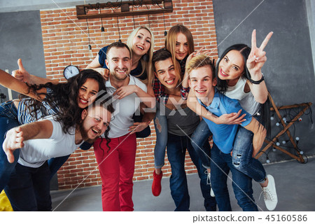 Group portrait of multi-ethnic boys and girls with colorful fashionable clothes holding friend Group portrait of multi-ethnic boys and girls with colorful fashionable clothes holding friend 45160586