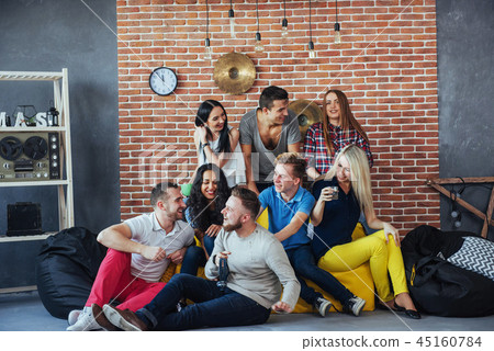Group portrait of multi-ethnic boys and girls with colorful fashionable clothes holding friend Group portrait of multi-ethnic boys and girls with colorful fashionable clothes holding friend 45160784