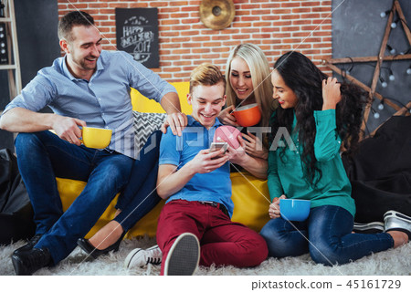 Group portrait of Cheerful old friends communicate with each other, friend posing on cafe, Urban Group portrait of Cheerful old friends communicate with each other, friend posing on cafe, Urban 45161729