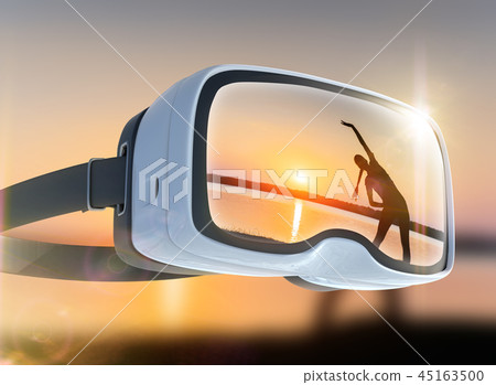 Virtual reality headset, double exposure. Woman sporting appearance at sunset Virtual reality headset, double exposure. Woman sporting appearance at sunset 45163500
