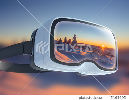 Virtual reality headset, double exposure. Mysterious winter landscape majestic mountains in 45163695