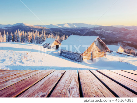 winter mountains landscape with a snowy forest and wooden hut winter mountains landscape with a snowy forest and wooden hut 45164395