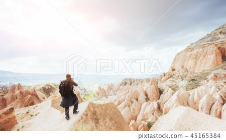 Photographer sandstone cliff and observing the natural landscape 45165384