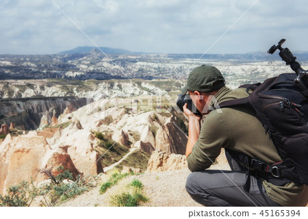 Photographer sandstone cliff and observing the natural landscape 45165394