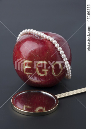Narcissism Concept: EGO engraved apple and mirror Narcissism Concept: EGO engraved apple and mirror 45166253