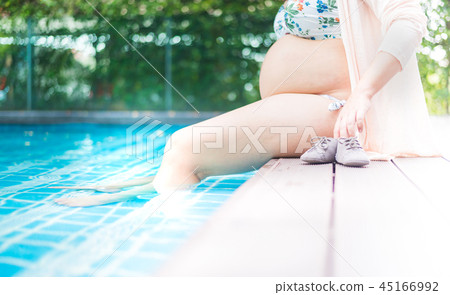 Asian pregnant woman with big belly. Asian pregnant woman with big belly. 45166992