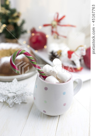 cup with marshmallows and Christmas candy. Marshma cup with marshmallows and Christmas candy. Marshma 45167763