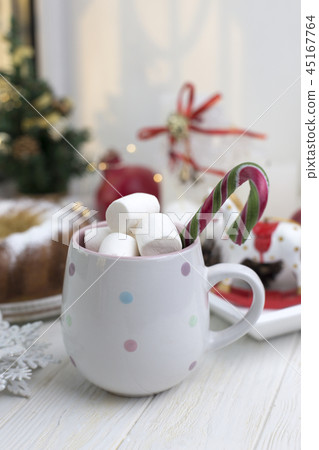 cup with marshmallows and Christmas candy. Marshma cup with marshmallows and Christmas candy. Marshma 45167764