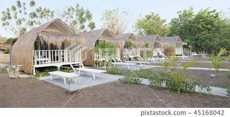Wooden cottage with thatched roof Wooden cottage with thatched roof 45168042