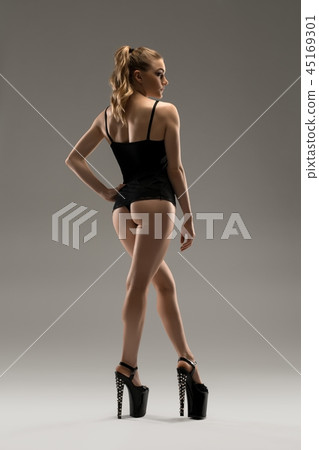 Sexy girl in lingerie and high heels rearview Sexy girl in lingerie and high heels rearview 45169301