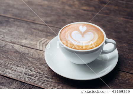 Close up white coffee cup with heart latte art 45169339