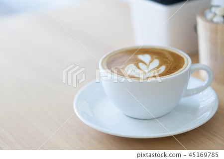 Glass of latte art coffee tulip shape on wood Glass of latte art coffee tulip shape on wood 45169785