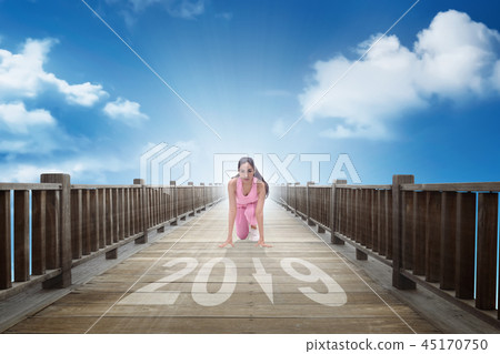 Asian woman ready to running into new year of 2019 Asian woman ready to running into new year of 2019 45170750