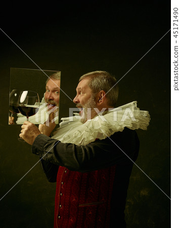 Official portrait of historical governor from the golden age. Studio shot against dark wall. Official portrait of historical governor from the golden age. Studio shot against dark wall. 45171490