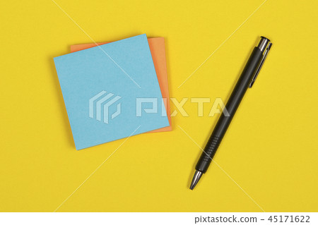 Colorful postit note on a yellow background 45171622
