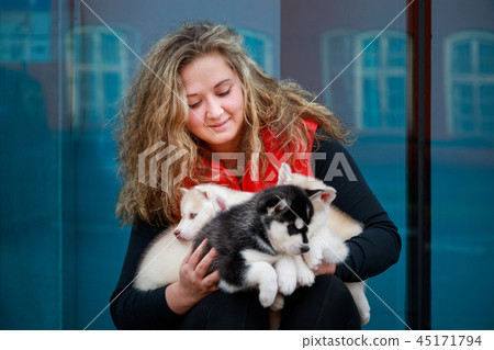 Portrait of the dog breeder with his pets 45171794