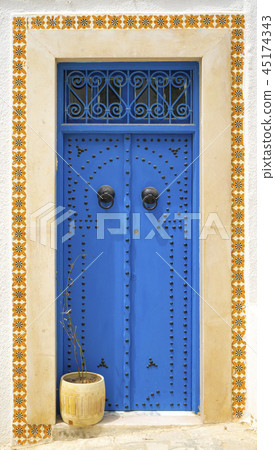 Aged Blue door in Andalusian style Sidi Bou Said 45174343