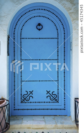 Aged Blue door in Andalusian style Sidi Bou Said Aged Blue door in Andalusian style Sidi Bou Said 45174345
