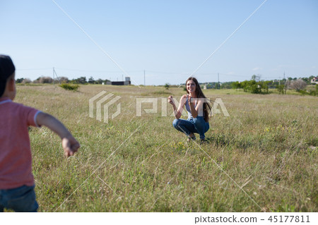 mom and young boy son play park love 45177811