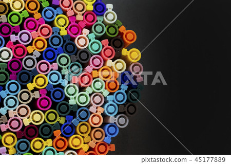 Set of several colored markers of different colors, the top view of the covers. Set of several colored markers of different colors, the top view of the covers. 45177889