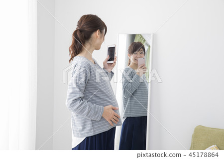 Pregnant woman taking self 45178864
