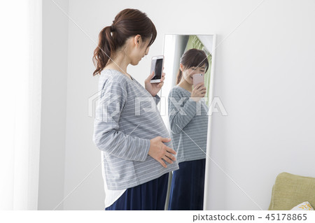 Pregnant woman taking self 45178865