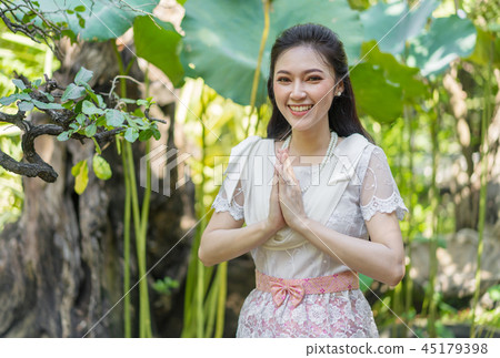 woman in Thai traditional dress is pay respect 45179398