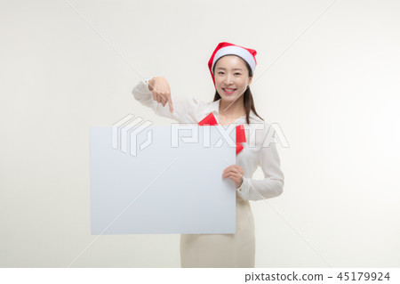 Christmas Day. Korea woman holding a white card Christmas Day. Korea woman holding a white card 45179924