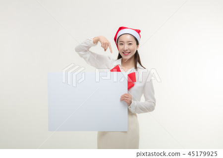 Christmas Day. Korea woman holding a white card Christmas Day. Korea woman holding a white card 45179925