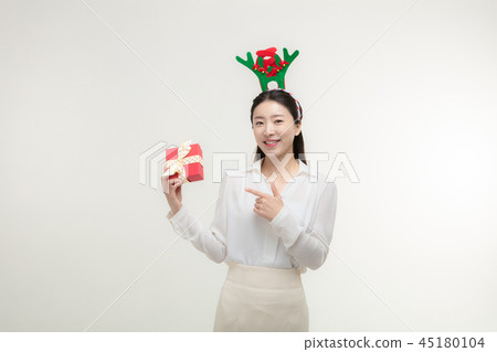 Christmas Day. Korea woman holding xmas props Christmas Day. Korea woman holding xmas props 45180104