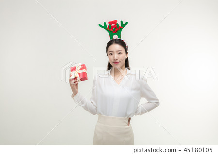 Christmas Day. Korea woman holding xmas props Christmas Day. Korea woman holding xmas props 45180105