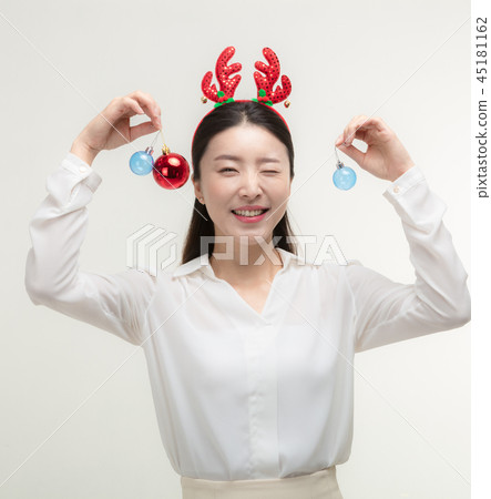 Christmas Day. Korea woman holding xmas props 45181162