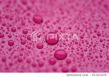 Closeup waterdrops on purple ceramic coated paint surface Closeup waterdrops on purple ceramic coated paint surface 45181876