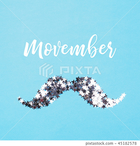 Mustache made of silver confetti on blue background. 45182578
