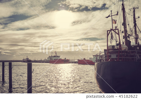 Retro toned picture of a harbor at sunset. Retro toned picture of a harbor at sunset. 45182622