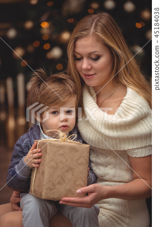 Mom and son near the Christmas tree Mom and son near the Christmas tree 45184038