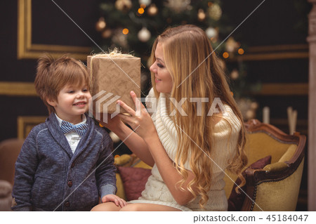 Mom and son near the Christmas tree 45184047