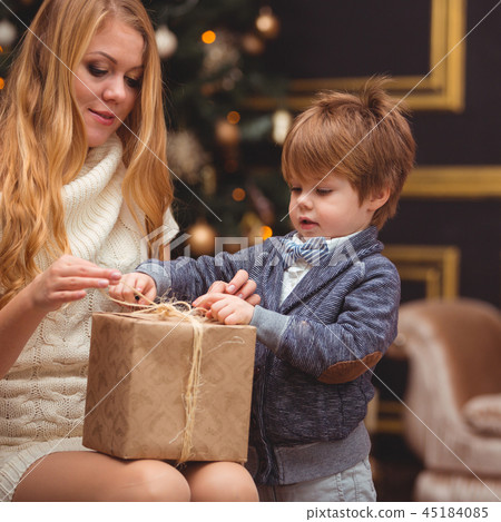 Mom and son near the Christmas tree Mom and son near the Christmas tree 45184085