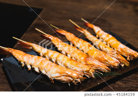 Salted grilled shrimp skewer in izakaya restaurant 45184159