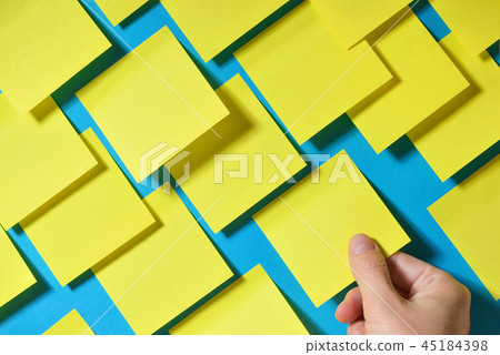 Hand holding post-it note Hand holding post-it note 45184398