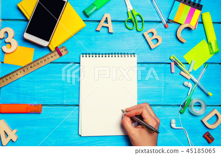 the student writes pen in a notebook. top view. 45185065