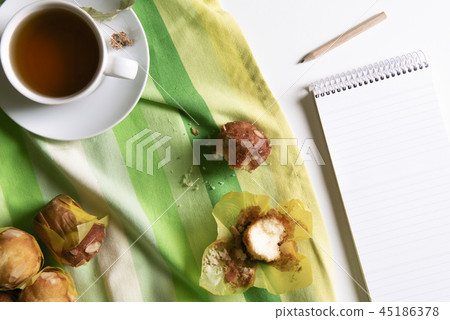 Tea and muffins and blank notebook Tea and muffins and blank notebook 45186378