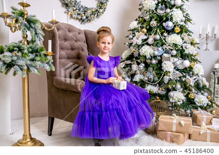 Pretty little girl 4 years old in a blue dress 45186400