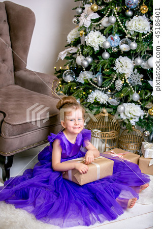 Pretty little girl 4 years old in a blue dress 45186401